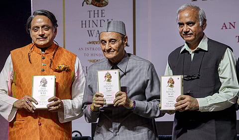 Veteran Congress leader Karan Singh flanked by party MP Shashi Tharoor and RSS ideologue Seshadri Chari R during the formal launch of Tharoor's new book The Hindu Way in New Delhi Thursday September 12 2019. | PTI