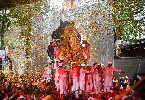 Devotees carry the Ganesha idol of Lalbaugcha Raja for immersion which marks the end of Ganesh Utsav celebrations in Mumbai on Thursday. (Photo | PTI)