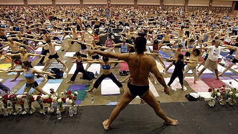 Bikram Choudhury (center, pantsless) leads a class in Los Angeles. (Photo | AP)