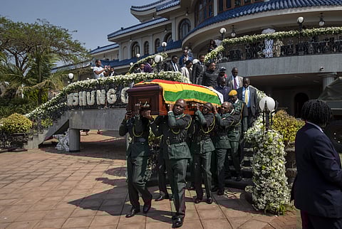The casket of former president Robert Mugabe is carried by the presidential guard to an air force helicopter for transport to a stadium where it will lie in state, at his official residence in the capital Harare. ( Photo | AP )