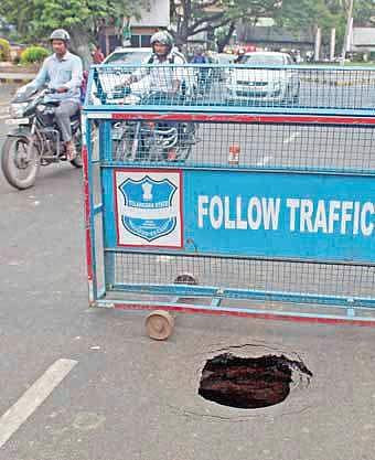 Portion of NTR Marg caves in opposite Lumbini Park on Friday | sathya Keerthi