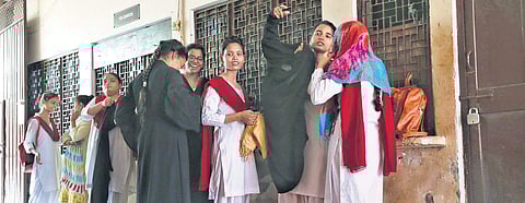Students at the M G college in Uttar Pradesh’s Firozabad change out of their burqas as they are not allowed to wear them in classrooms. While some colleges have changing rooms, others force them to change in the open | ( Photo | Arun Kumar )