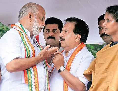 Opposition leader Ramesh Chennithala with UDF candidate Jose Tom in Pala on Sunday. Roshi Augustine, MLA, and | Express