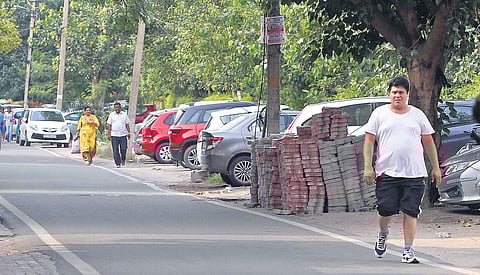 Cars are parked all along a road in Lajpat Nagar 3, where SDMC is carrying out a pilot project to solve parking issues. | ( Photo | Arun Kumar )