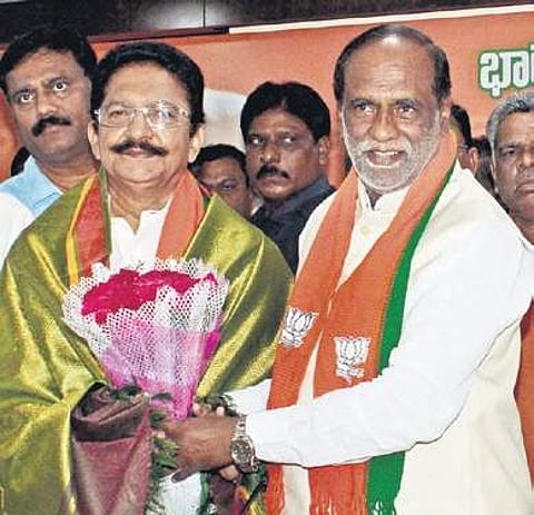 BJP State unit president K Laxman welcomes former Maharashtra Governor Ch Vidyasagar Rao into the saffron party in Hyderabad on Monday