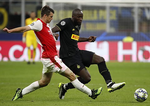 Slavia's Ondrej Kudela, left, challenges Inter Milan's Romelu Lukaku during the Champions League group F soccer match between Inter Milan and Slavia Prague at the San Siro stadium in Milan, Italy. (Photo | AP)