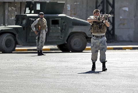 Afghan security forces guard the site of a suicide attack near the U.S. Embassy in Kabul, Afghanistan, Tuesday. (Photo | AP)