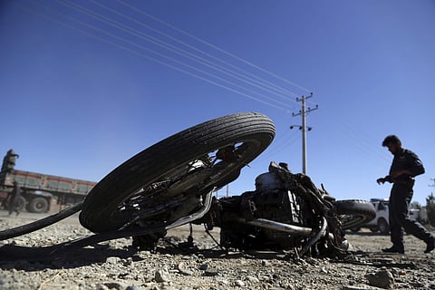 Afghan police inspect the site of a suicide attack, in northern Parwan province, Afghanistan, Tuesday. (Photo | AP)
