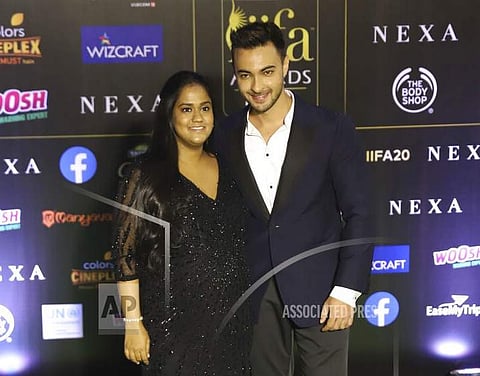 Bollywood actor Aayush Sharma stands with his wife Arpita Khan as they arrive to attend the 20th International Indian Film Academy awards ceremony in Mumbai. (Photo | AP)