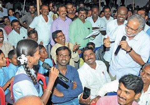 Minister Suresh Kumar interacts with students of government primary school at Achammanahalli village in Tumakuru on Thursday | EXPRESS