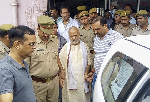 Former Union minister Swami Chinmayanand outside a government hospital after a medical examination following his arrest in Shahjahanpur, Uttar Pradesh. (Photo | PTI)