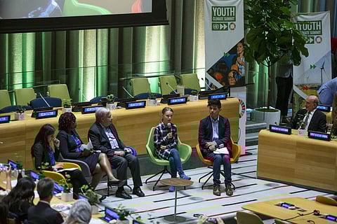 Swedish environmental activist Greta Thunberg, center, speaks to guests next to U.N. Secretary-General Antonio Guterres, center left, during the Youth Climate Summit at United Nations headquarters, Saturday, Sept. 21, 2019. (Photo | AP)