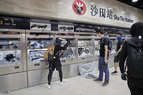 Protesters vandalize a subway station in Hong Kong on Sunday, Sept. 22, 2019. Protesters smashed surveillance cameras and electronic ticket sensors in the subway station, as pro-democracy demonstrations took a violent turn once again. (Photo | AP)