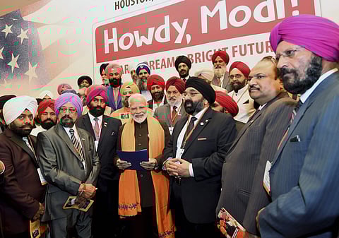 PM Modi with members of the Sikh community in Houston, US. (Photo | PTI)