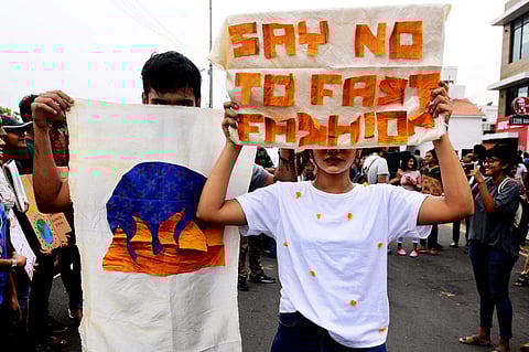 'Say no to fast fashion', reads another poster raising awareness on the importance of sustainable fashion in preserving the Earth's ecosystem. (Photo | Debadatta Mallick, EPS)