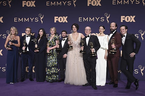 Director Harry Bradbeer, fourth from right, and the cast and crew of 'Fleabag,' winners of the award for outstanding comedy series, pose in the press room at the 71st Primetime Emmy Awards on 22 September 2019. (Photo | AP)