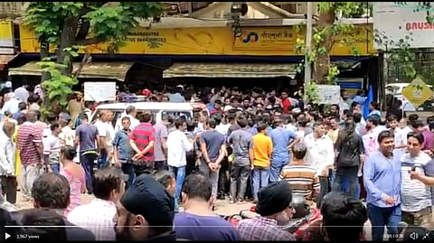 People gathered outside the PSM Bank. (Photo | Youtube screengrab)