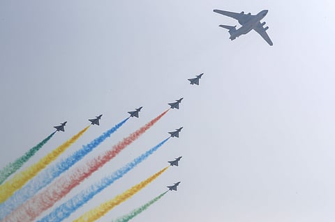 Chinese military planes flew in formation above the city center in Beijing. ( Photo | AP )