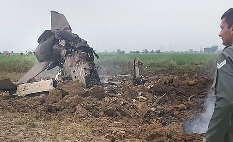 An Indian Air Force official inspect the site where MiG-21 trainer jet crashed near the Gwalior airbase Wednesday September 25 2019. | (Photo | PTI)