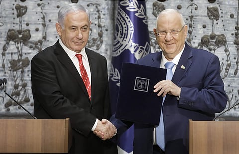 Israeli President Reuven Rivlin shakes hands with PM Benjamin Netanyahu who has been given the task of forming a new government. ( Photo | AP )