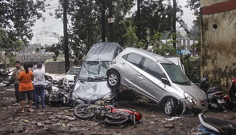 Vehicles are piled up on a street after a flash flood following heavy rains in Pune. (Photo | PTI)