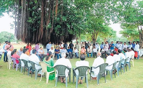 Vasu Poshayanandana, expert from ICMOS and other officials interact with villagers at Palampet village on Thursday