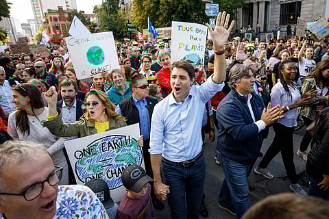 Walking with his wife and children, Trudeau mingled with a boisterous crowd that brandished placards reading 'Respect Mother Earth' and 'Make America Greta Again.' (Photo | @JustinTrudeau, Twitter)