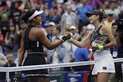 Belinda Bencic, of Switzerland, right, shakes hands after defeating Naomi Osaka, of Japan, 7-5, 6-4 during the fourth round of the US Open tennis championships. (Photo | AP)