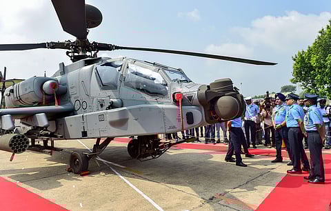Air Chief Marshal Birender Singh Dhanoa inspects an Apache attack helicopter during the induction ceremony of eight US-made Apache AH-64E helicopters into the Indian Air Force at Airforce Station Pathankot Tuesday September 3 2019. | PTI