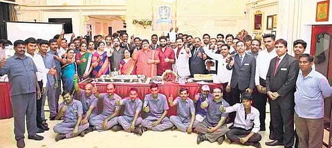 Staff members at the 20th anniversary of Hotel Ambica Empire, which was presided over by chairman Ambica Krishna