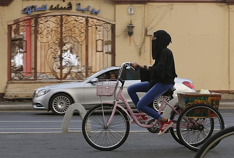 A Saudi woman rides her bicycle, in Jeddah, Saudi Arabia. (Photo | AP)