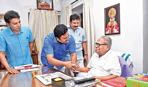 LDF candidate for Aroor assembly constituency Manu C Pulickal seeking the blessings of Administrative Reforms Commission chairman V S Achuthanandan at the latter’s residence in Thiruvananthapuram on Sunday. A M Ariff, MP, and Achuthanandan’s son V A Arun