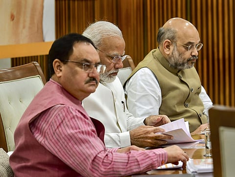 Prime Minister Narendra Modi flanked by Union Home Minister Amit Shah and BJP Working President JP Nadda during party's Central Election Committee CEC meeting in New Delhi Sunday Sept. 29 2019. | (Photo | PTI)