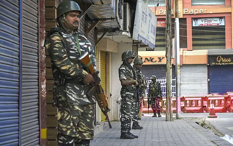 Security personnel stand guard during shutdown in Srinagar Sunday Sept. 29 2019. | (Photo | PTI)