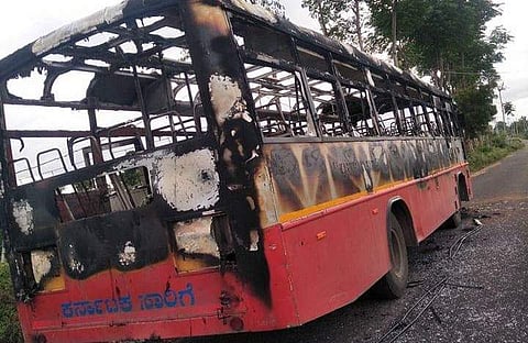 A KSRTC bus burnt completely by people protesting DK Shivakumar's arrest. (Photo | EPS)