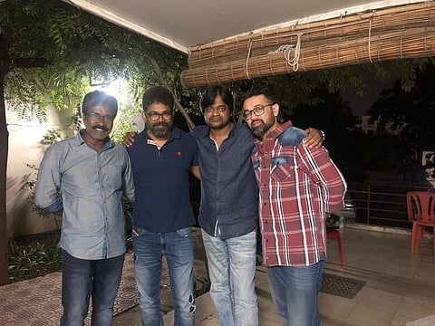 Director Sukumar (2nd from R) with the crew