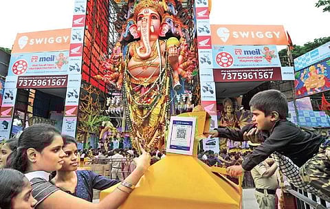 Devotees line up to make offerings at a digital hundi setup near Khairatabad Ganesh idol in Hyderabad (Photo| EPS, S Senbagapandiyan)