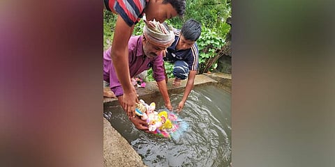 People immerse a PoP Ganesh idol in water mixed with ammonium bicarbonate, in Nagardale | Express