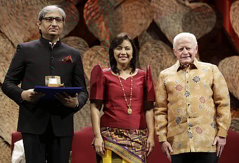 Philippine Vice President Leonor Robredo, center, and Ramon Magsaysay Chair, Board of Trustees, Jose Cuisia Jr., right, poses with Ramon Magsaysay 2019 awardee Ravish Kumar during ceremonies in Manila, Philippines. (Photo | AP)