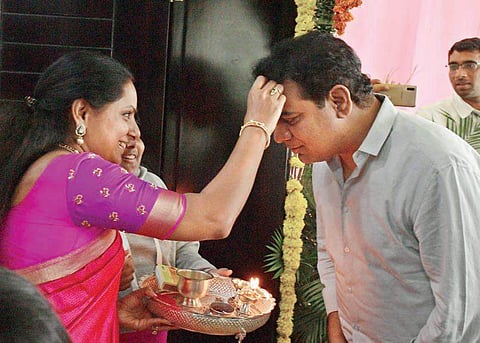 KTR being welcomed with tilak by his sister Kavitha at his house after being sworn in as Cabinet minister. (Photo | EPS)