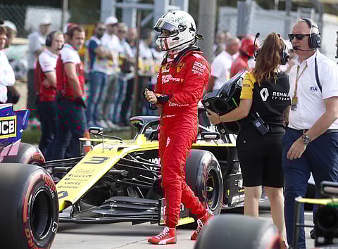 Ferrari driver Sebastian Vettel of Germany walks at the pit at the end of qualifying session at the Monza racetrack, in Monza, Italy, Saturday, Sept. 7, 2019. The Formula one race will be held on Sunday. | AP