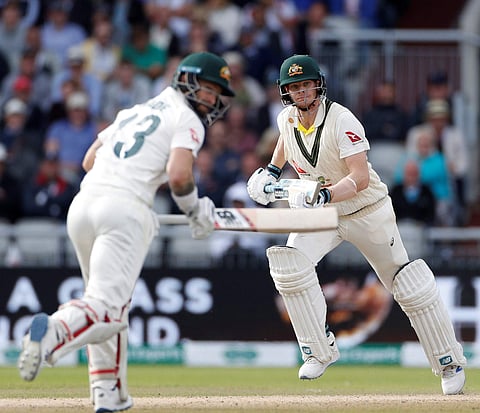 Australia's Steve Smith, right, and Matthew Wade run between wickets during day four of the fourth Ashes Test cricket match between England and Australia at Old Trafford in Manchester, England, Saturday, Sept. 7, 2019. | AP