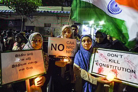 Protesters raise slogans at a midnight candle light demonstration against the CAA during the new year celebrations in Chennai Wednesday Jan. 1 2020. (Photo | PTI)