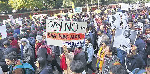 Students and teachers during a protest march slamming CAA-NRC-NPR and demanding removal of JNU vice-chancellor, in New Delhi on Thursday. (Photo| EPS/ Arun Kumar)