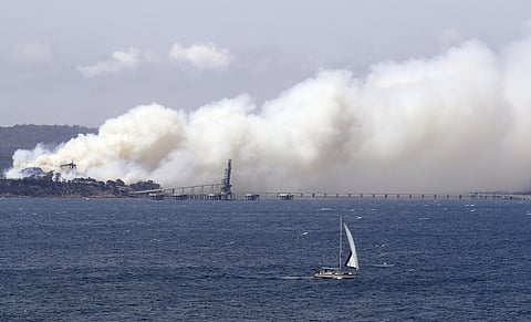 Thousands of people fled their homes and helicopters dropped supplies to towns at risk of nearby wildfires. (Photo | AP)