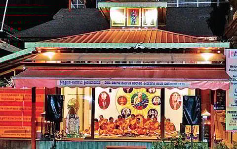 Members of a professional bhajan troupe sing bhajans near Sri Krishna Mutt in Udupi