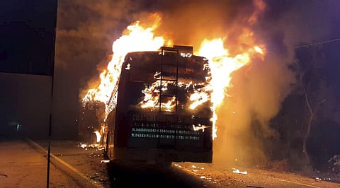A bus catches fire after collision with a truck on GT Road at Kannauj district in Uttar Pradesh (Photo| PTI)