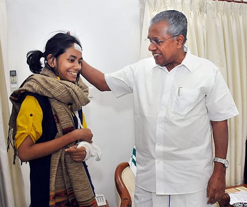Kerala Chief Minister Pinarayi Vijayan with JNU Students Union president Aishe Ghosh during a meeting at Kerala House in New Delhi Saturday Jan. 11 2020. (Photo | PTI)