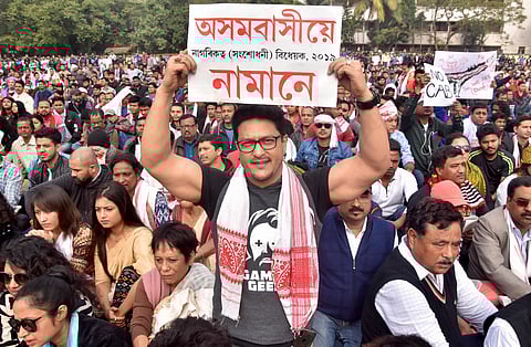 Assamese film actor Ravi Sharma holds a placard as he takes part in a hunger strike organised by All Assam Students Union AASU in protest against the passing of Citizenship Amendment Bill in Guwhati Friday Dec. 13 2019. (File Photo | PTI)