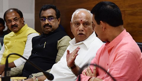 BJP National General Secretary Ram Madhav, CM B S Yediyurappa and BJP state president Nalin Kumar Kateel at the meeting. (Photo | Vinod Kumar T, EPS)